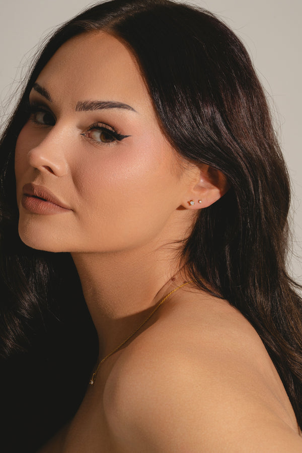 classic and mini lab grown diamond stud earrings on model